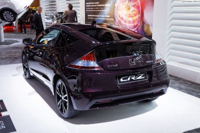 Sleek black hatchback rear with sporty wheels and distinctive taillights