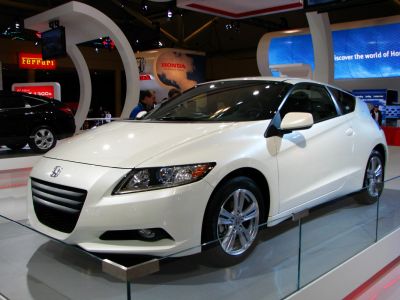 Front and side view of hybrid sporty hatchback with sleek headlights and alloy wheels