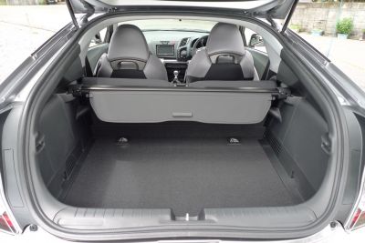 Hatchback trunk cargo space with rear seats and dashboard visible