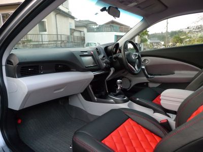 Sporty interior with quilted red leather seats and manual transmission