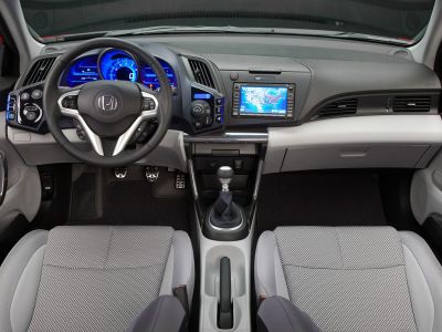 Digital dashboard, touchscreen navigation, manual gear stick