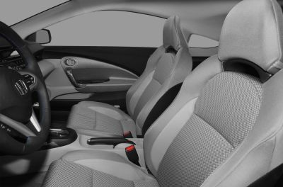 Sporty bucket seats and ergonomic dashboard in compact cabin