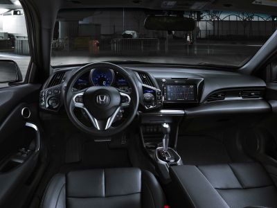 Interior view focusing on the steering wheel and dashboard with infotainment