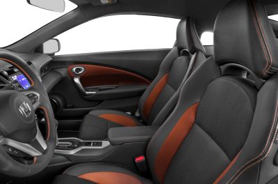 Sporty black and orange seats with contrast stitching in a modern car interior