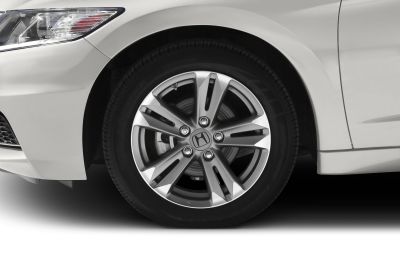 Close-up of alloy wheel and front fender area of a vehicle