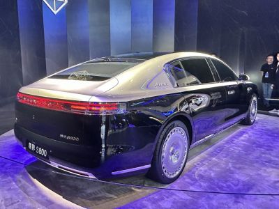 Luxury sedan rear design with LED taillights and chrome trims.