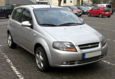 Compact 5-door hatchback with rounded front headlights and simple grille