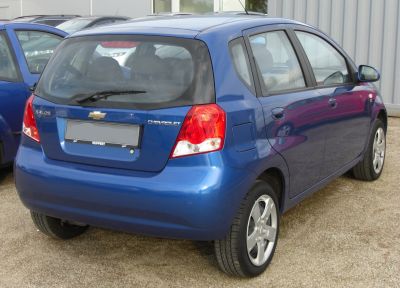 Rear view of 5-door hatchback with tail lights, alloy wheels, and rear wiper