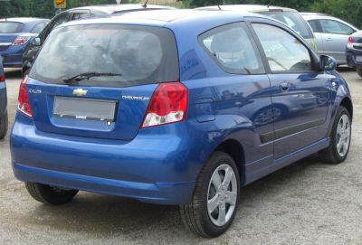 Blue 3-door compact hatchback rear and side view with distinctive taillights