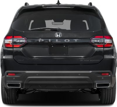 Rear view of an SUV with integrated tail lights and dual exhaust