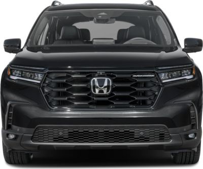 Front view with black hexagonal grille and LED headlights