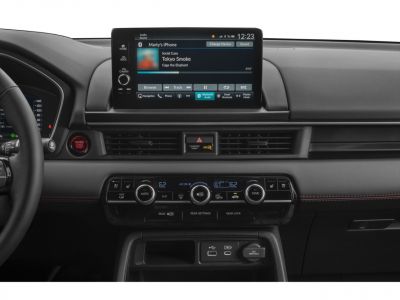 Infotainment touchscreen and digital climate control panel with USB ports and engine start button