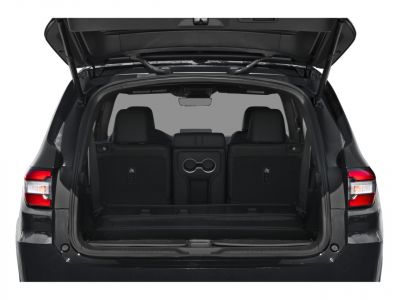 Spacious rear cargo area with rear seats and integrated cup holders