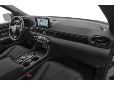 Modern vehicle interior featuring dashboard, infotainment screen, and center console.