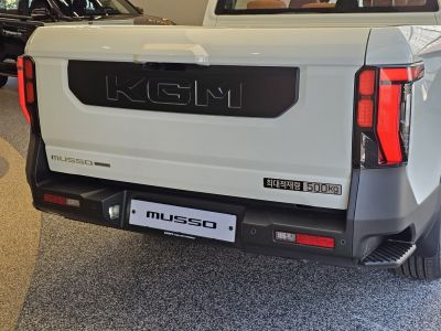 Pickup truck rear featuring bold branding and modern taillights
