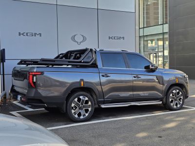Modern pickup truck with extended cargo bed and reinforced roll bars