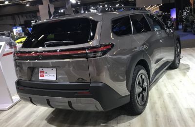 Rear view with continuous LED lightbar and rugged SUV design