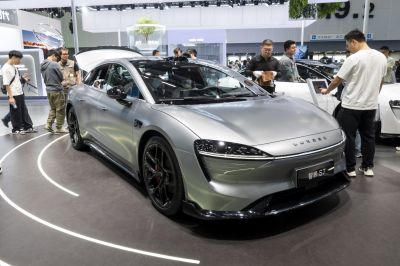 Electric sedan with sleek aerodynamic front and black alloy wheels