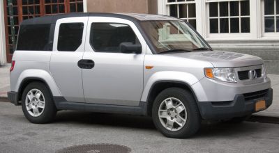 Boxy, rugged SUV with distinctive angular design and unique rear side doors