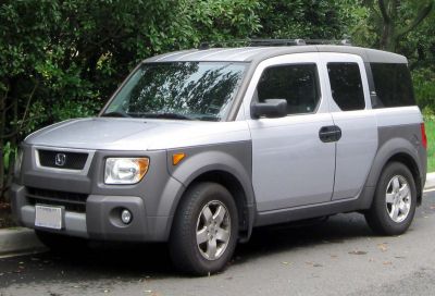 Boxy SUV front side view with roof rails and alloy wheels