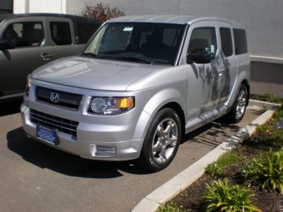 Silver SUV with boxy design and clear headlight details