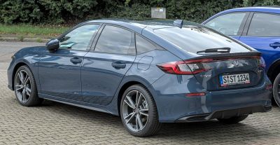 Rear and side view with sharp tail lights and alloy wheels