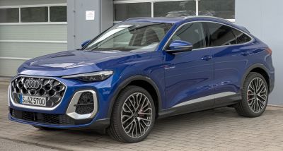 Hexagonal grille and sporty alloy wheels on SUV coupe front side