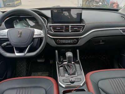 Steering wheel, central touchscreen, gear shift and dashboard controls