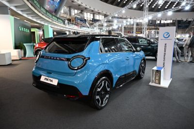 Rear view with unique round taillights and modern blue compact hatchback design