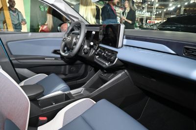 Modern digital dashboard and multifunction steering wheel inside a compact car