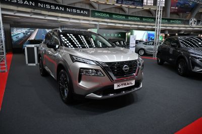 Front view of a modern silver SUV with LED headlights and a distinctive grille