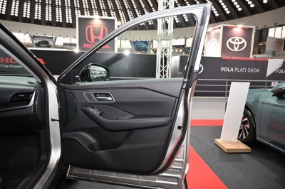 Interior door panel with controls and sleek design