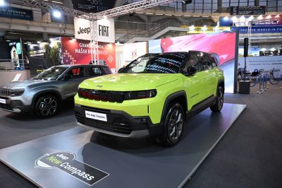 Futuristic front grille and sleek LED headlights on a neon green SUV