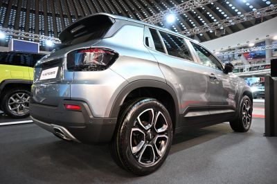Rear side view of modern SUV with stylish alloy wheels and tail lights