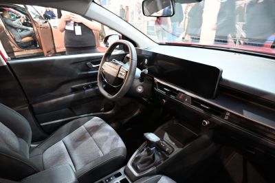 Modern steering wheel with multifunction controls and large dashboard display