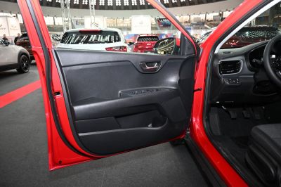 Front door interior panel with control switches and speaker