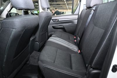 Spacious rear seat interior with fabric upholstery and seatbelts