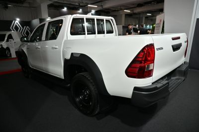 Rear and side view of pickup truck bed with protective rack and taillights