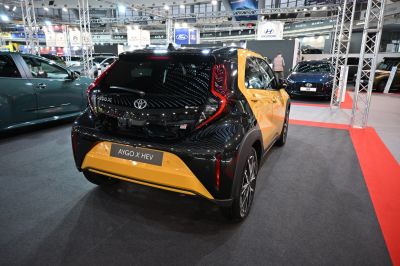 Rear view of two-tone Toyota Aygo X hybrid with modern lighting
