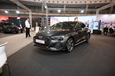 Front and side view of modern sedan with LED headlights and sleek design