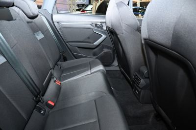 Rear passenger seat area with fabric upholstery and rear ventilation
