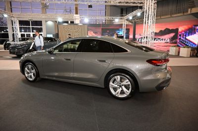 Side profile of sedan with alloy wheels and tinted windows
