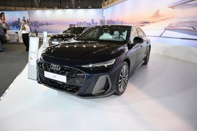 Sleek front view with LED headlights and bold grille