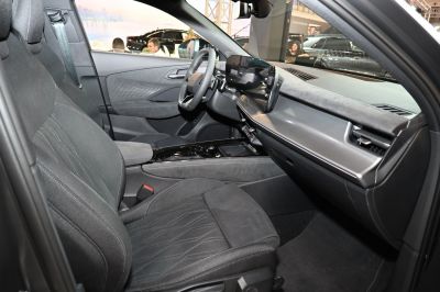 Digital dashboard, sleek center console, and sporty seats in a modern car interior
