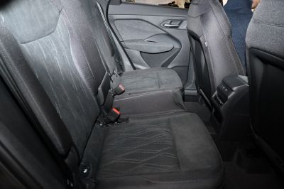 Black fabric rear seats with detailed stitching and door panel view