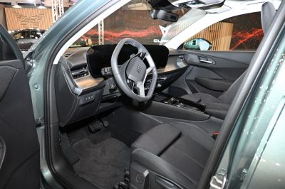 Modern car interior with digital dashboard and steering wheel