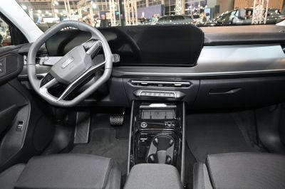 Minimalist car interior with digital dashboard and multifunction steering wheel