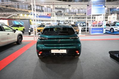 Rear view of a modern compact hatchback with distinctive taillights and sporty bumper.