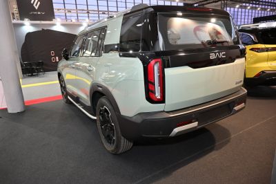 SUV rear and side view with distinctive vertical taillights and two-tone body design.
