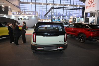 Rear view of vehicle with vertical tail lights and black panel